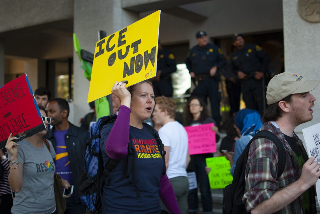 Protesters outside the Alameda County Sheriff's Office on Aug. 16, 2017, calling for an end to cooperation between local law enforcement and U.S. Immigration and Customs Enforcement. Photo: Scott Morris