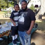 Dujuan Armstrong and his son. Photo courtesy of Barbara Doss.