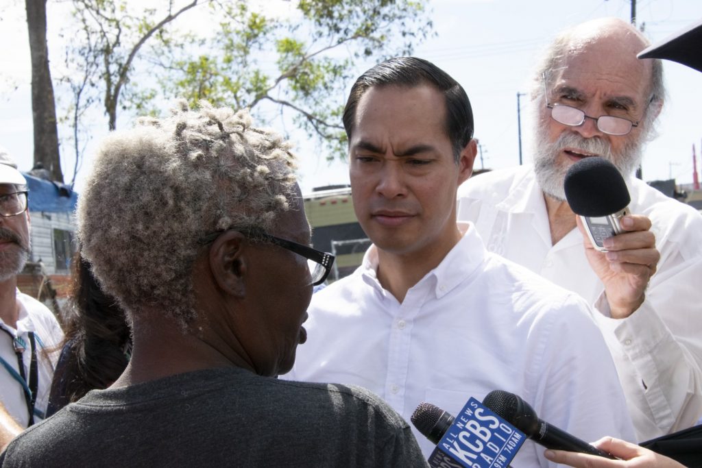 Democratic Presidential Candidate Julián Castro speaks to Elizabeth Easton, a resident of an Oakland homeless encampment, on Sept. 25. Photo by Scott Morris