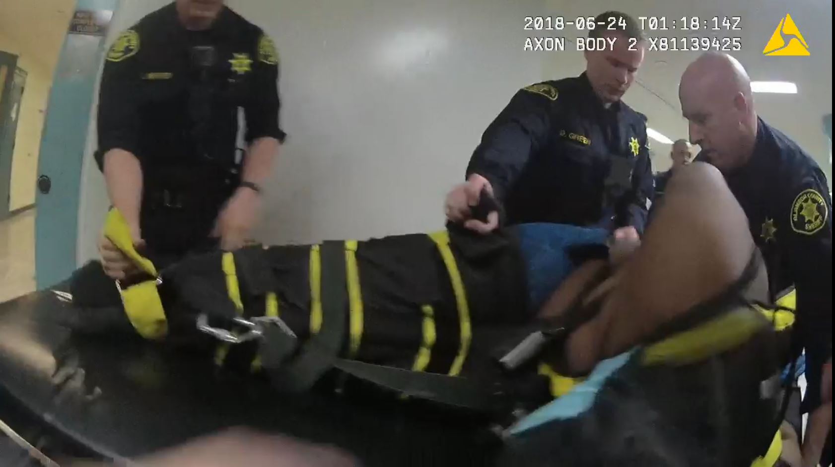 Deputies use a WRAP restraint on Dujuan Armstrong that caused his death in Santa Rita Jail. Alameda County Sheriff's Office video still.