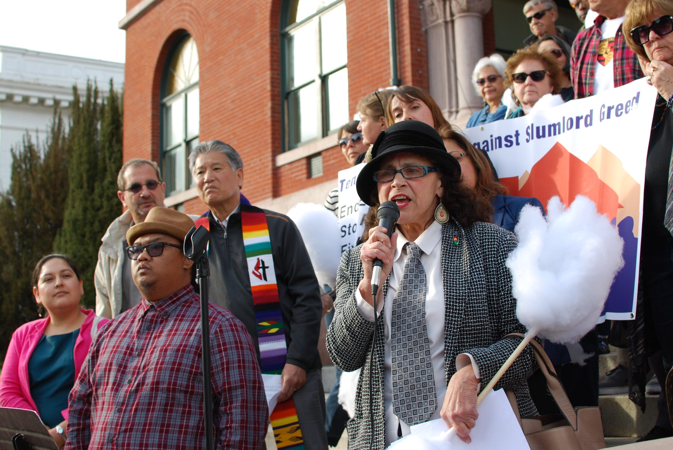 Alameda resident Gabrielle Dolphin speaks in favor of stronger tenant protections before a City Council meeting on April 4. Photo by Scott Morris.