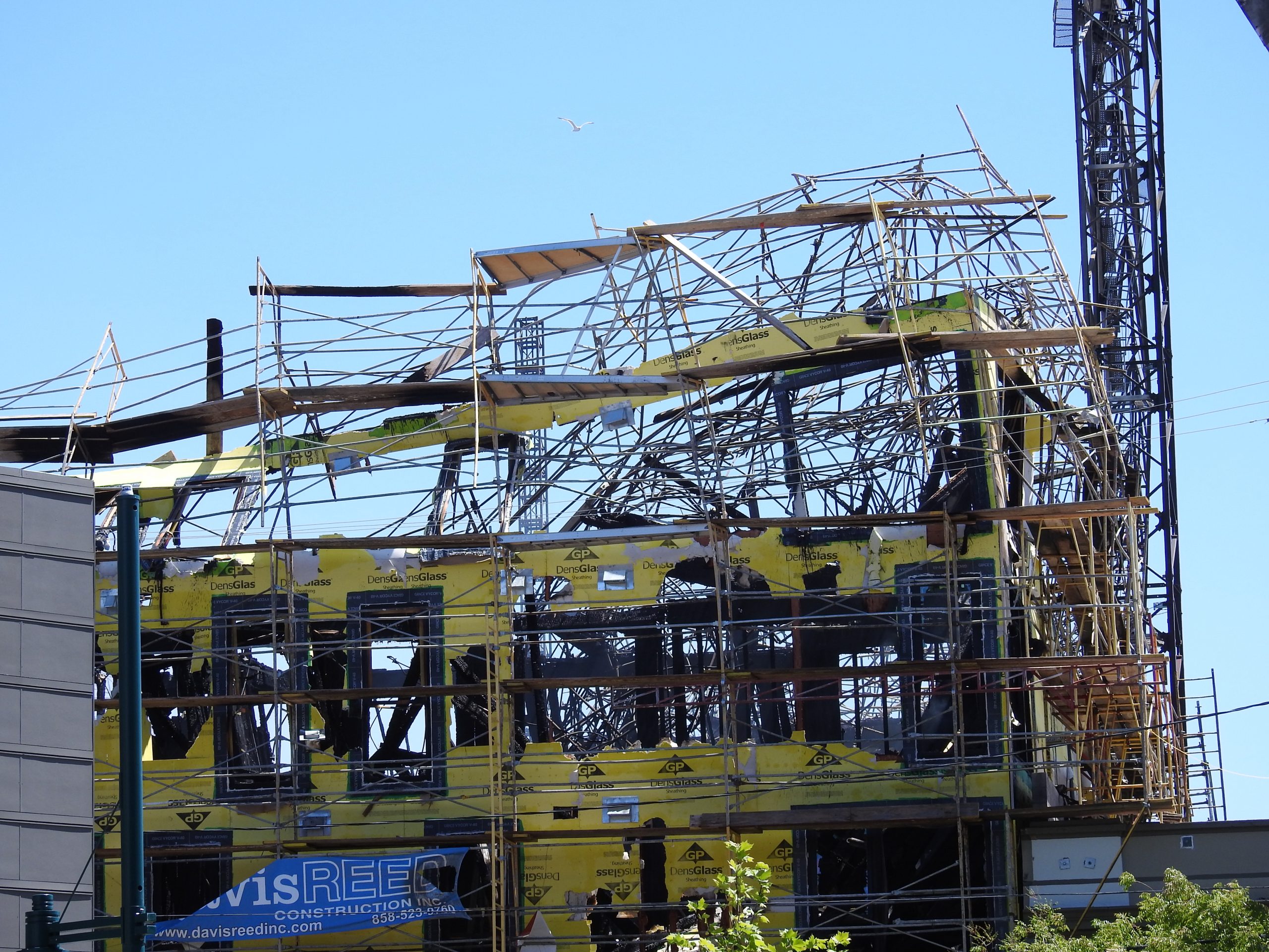 A planned seven-story 105-unit apartment building at 3800 San Pablo Ave. on the Oakland-Emeryville border was burned down by an arsonist or arsonists twice since July 2016. Photo by Scott Morris.