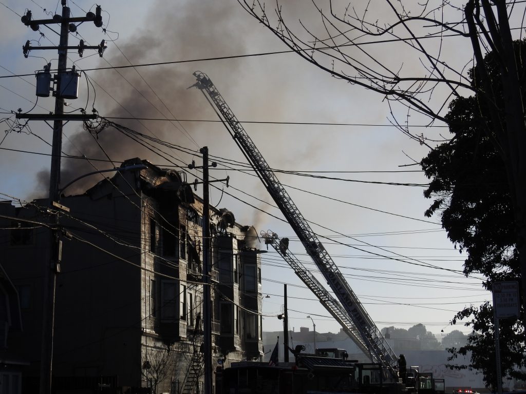 A fire at a halfway house at 2551 San Pablo Ave. killed four people on Mach 27, 2017. Photo by Scott Morris.