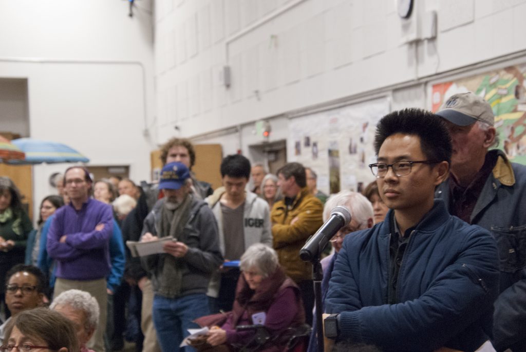 Residents line up to speak at a meeting to discuss possible housing constructed at the North Berkeley BART station. Photo by Scott Morris.