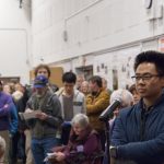 Residents line up to speak at a meeting to discuss possible housing constructed at the North Berkeley BART station. Photo by Scott Morris.