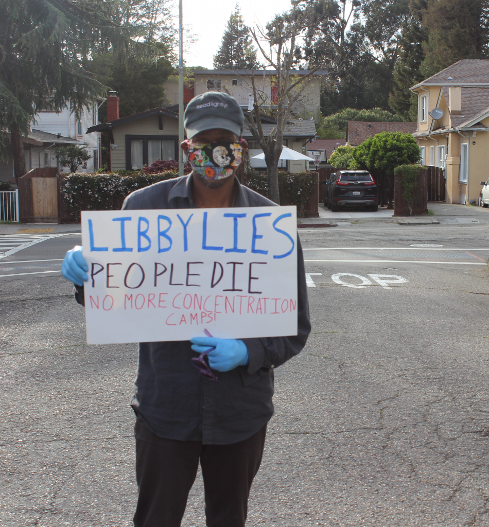 Lamonte Ford, an unhoused person who lives on Wood Street, poses after the protest at Mayor Libby Schaaf's house. Photo by Zack Haber 